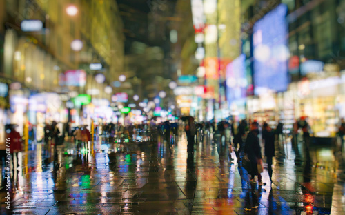 crowd of people on night street in the city