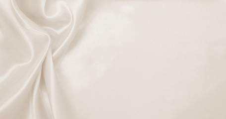 Smooth elegant golden silk or satin luxury cloth texture as wedding background. Luxurious background design. In Sepia toned. Retro style