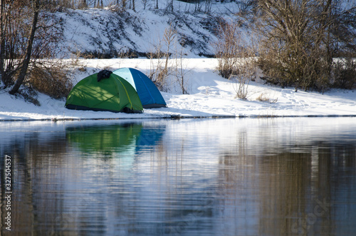 Camping tent on the lake shore in Turkey mountains.