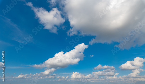 A blue sky with white clouds