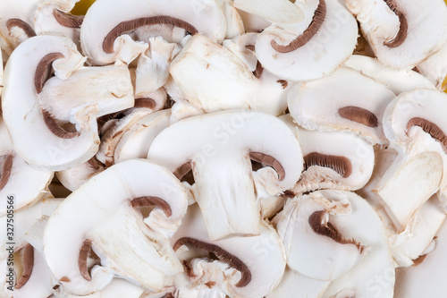 Background of slices of cultivated button mushrooms close-up