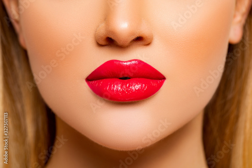 Sexy Red Lips closeup. Beauty Lips with Red Lipstick. Natural Decorative professional Cosmetics. Perfect makeup. Young Woman close up. Profile. Face close-up focus on Lips.      