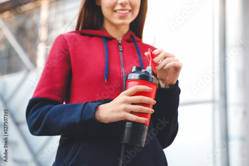Young sporty woman with pro...