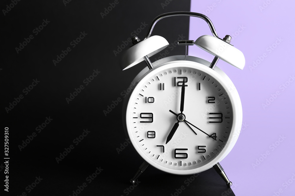 Alarm clock on color background. Time management concept Alarm clock on color background. Time management concept