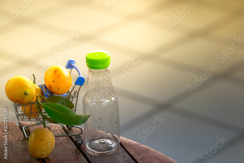 background of seasonal fruits (yellow)is appetizing golden yellow, placed on a wooden table or a small shopping cart