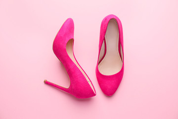 Stylish female shoes on pink background