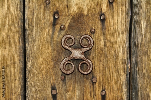 a metal handle on an old door