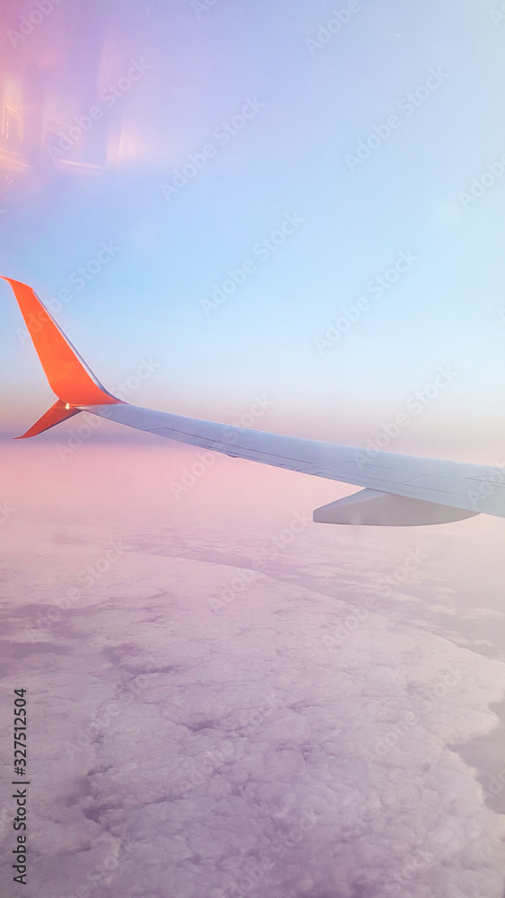 Beautiful view of the landscape from the window of an airplane. In the frame of an airplane wing