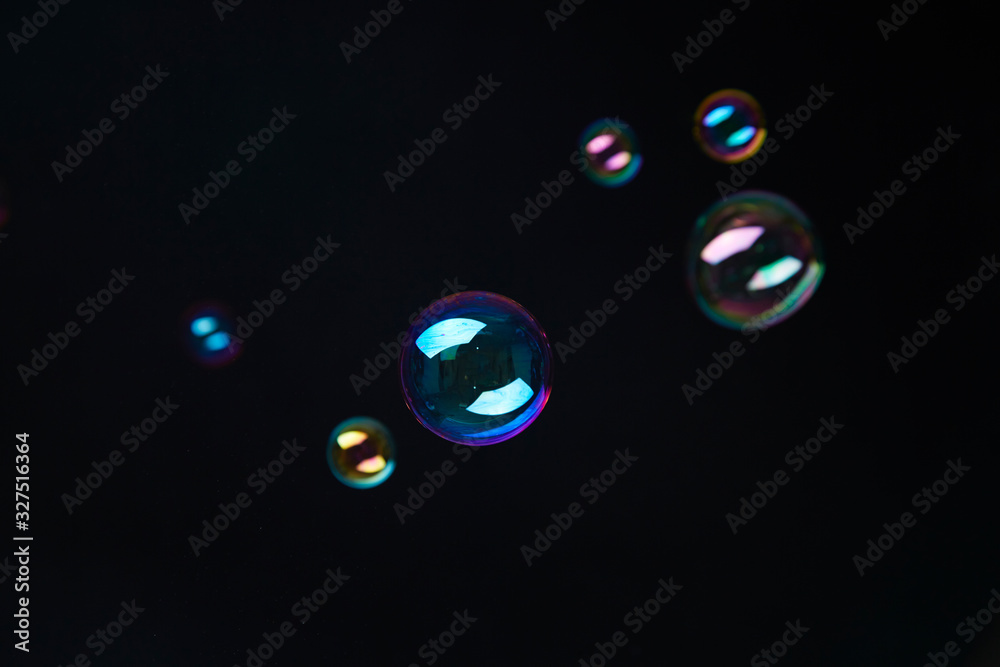 Naklejka premium Beautiful bubbles on black background