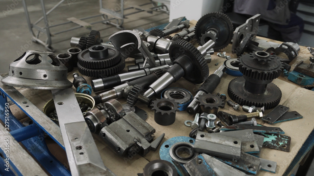 Wooden table with details and tools from outer diameter grinder Wooden table with details and tools from outer diameter grinder