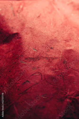 Close up view of red abstract texture and background made of recycled paper. 