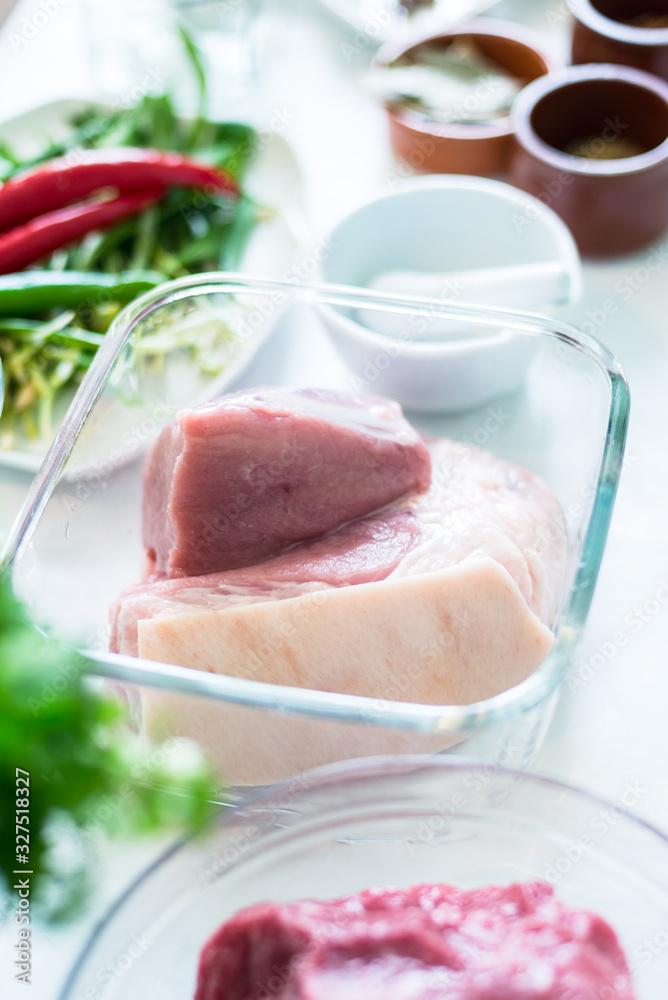 Lifestyle photo, Beef in glass bown on kitchen table Lifestyle photo, Beef in glass bown on kitchen table