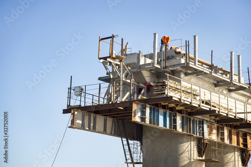 Bridge construction manual labour, the place of workers on tall poles