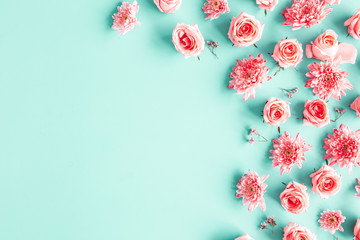 Flowers composition. Rose flowers on blue background. Valentines day, mothers day, womens day concept. Flat lay, top view, copy space