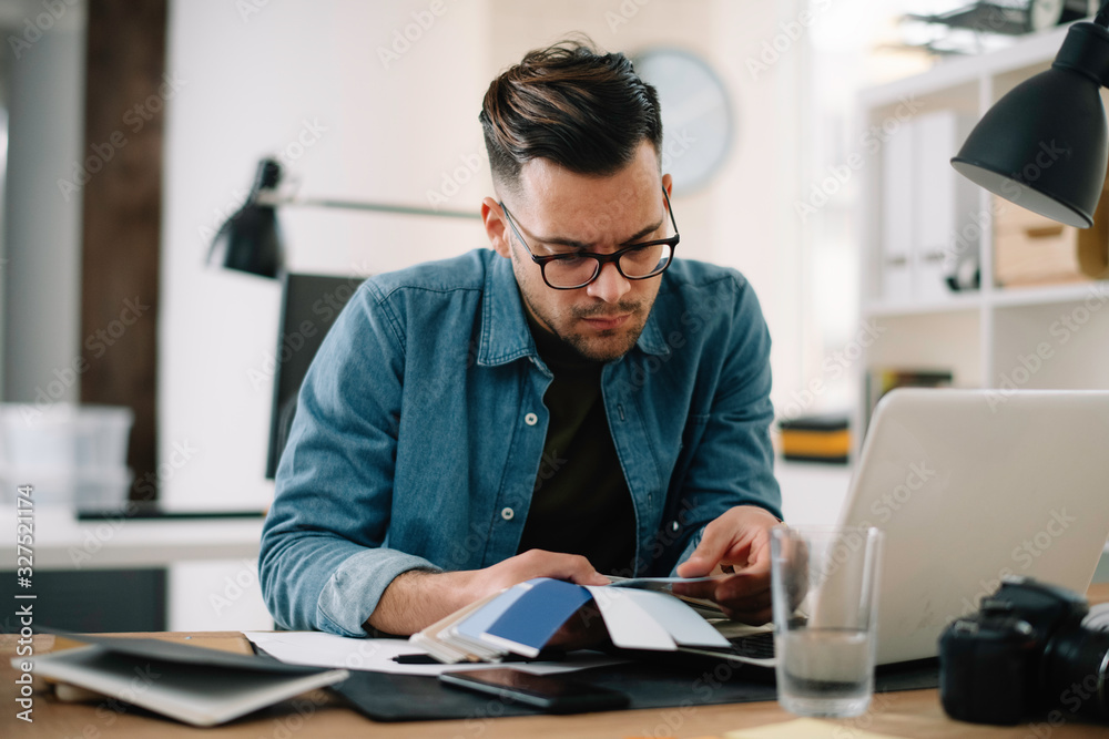 Designer in office. Businessman working on new architect project. Designer in office. Businessman working on new architect project.