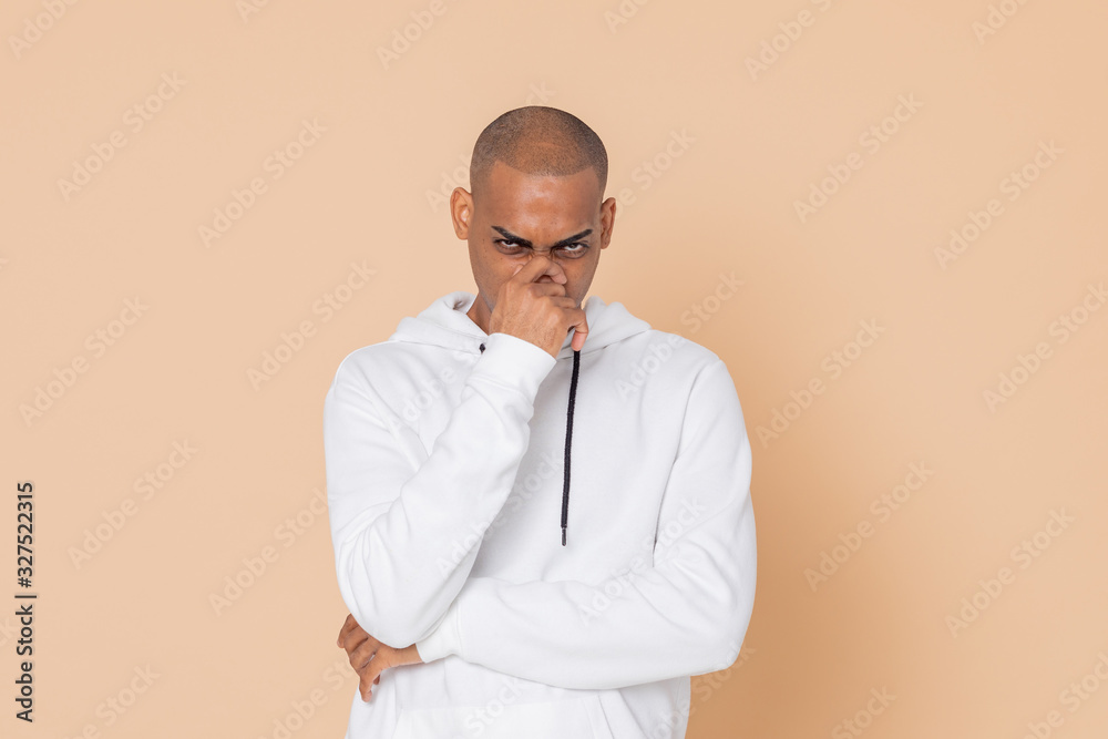 Pensive African guy with a white sweatshirt Pensive African guy with a white sweatshirt