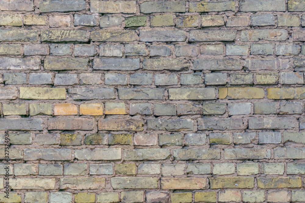 Fototapeta premium Aged dirty brick wall. Old brickwall background