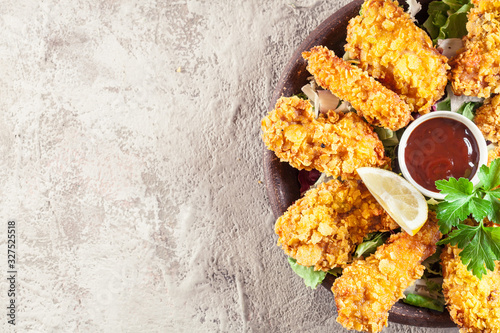 Chicken strips in cornflakes breadcrumb