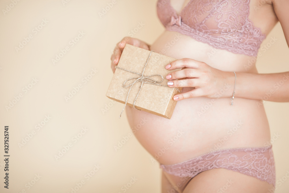 Young attractive pregnant woman indoors. Maternity concept. - obrazy, fototapety, plakaty 