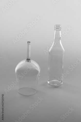 ISOLATED GLASS AND A BOTTLE ON WHITE BACKGROUND 