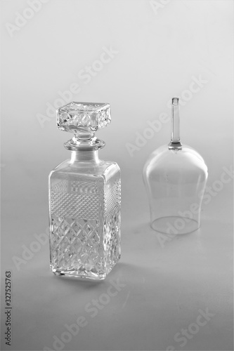ISOLATED GLASS AND A BOTTLE ON WHITE BACKGROUND 
