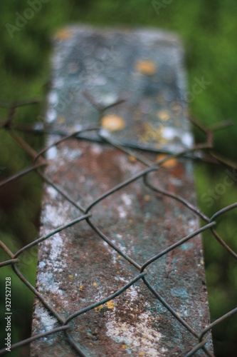 Rusty fence and post