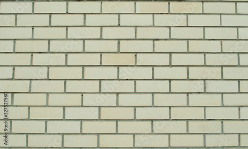 Yellow brick wall texture. Grunge brick wall.