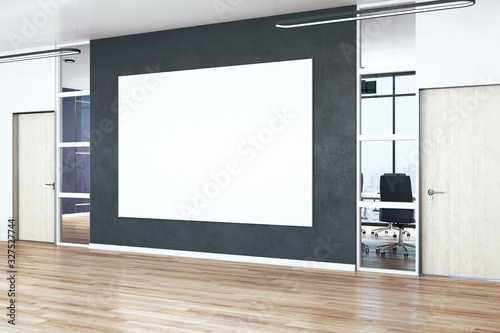 Modern office hall with blank poster on wall.