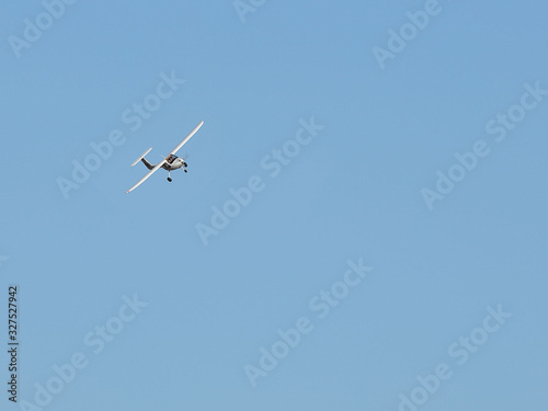 Yaslo, Poland - 7 9 2019: A light sport turboprop aircraft flies across the sky among the rainy clouds. Landing in difficult weather conditions. Meteorology and weather forecast for aviation