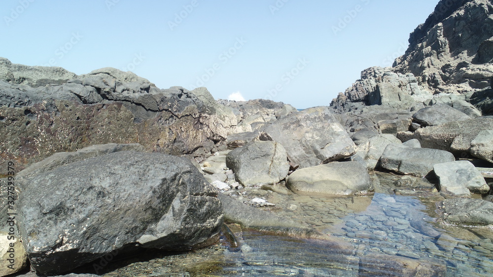 Relax contemplating the breaking of the waves and the mountainous horizon Relax contemplating the breaking of the waves and the mountainous horizon