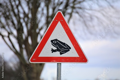 warning sign on the road in winter