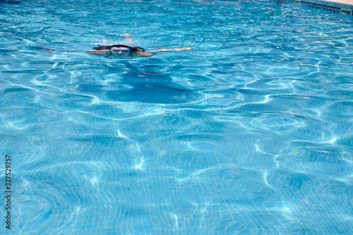 person swimming in the pool © luismicss