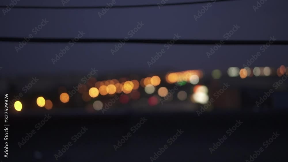 Beautiful glittering bokeh in dark blurry background at night. Defocused Night City Traffic Lights. Beautiful glittering bokeh in dark blurry background at night. Defocused Night City Traffic Lights.