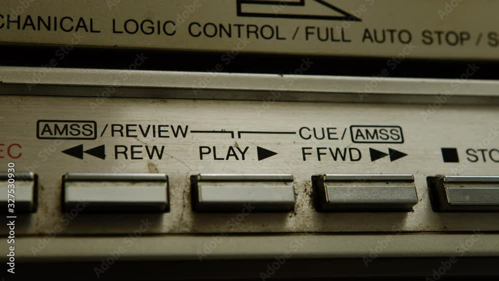 Close up of old cassette player boombox buttons, press the play button. Retro concept. Close up of old cassette player boombox buttons, press the play button. Retro concept.