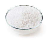 Sea salt in glass bowl isolated on white background with clipping path