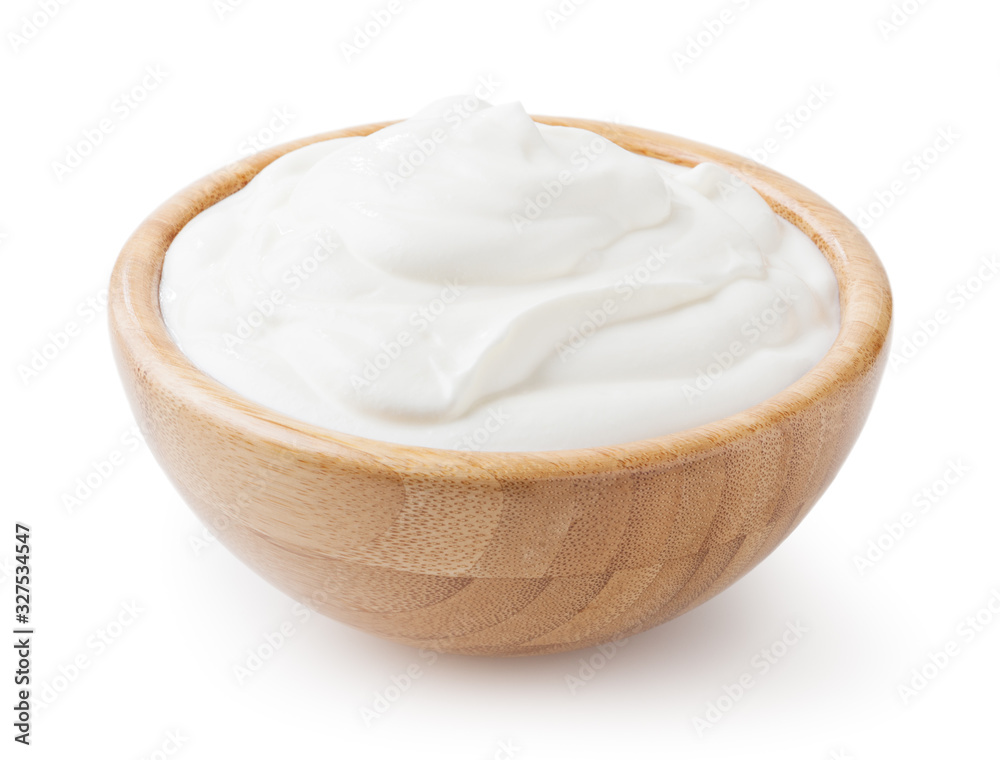 Sour cream in wooden bowl isolated on white background with clipping path