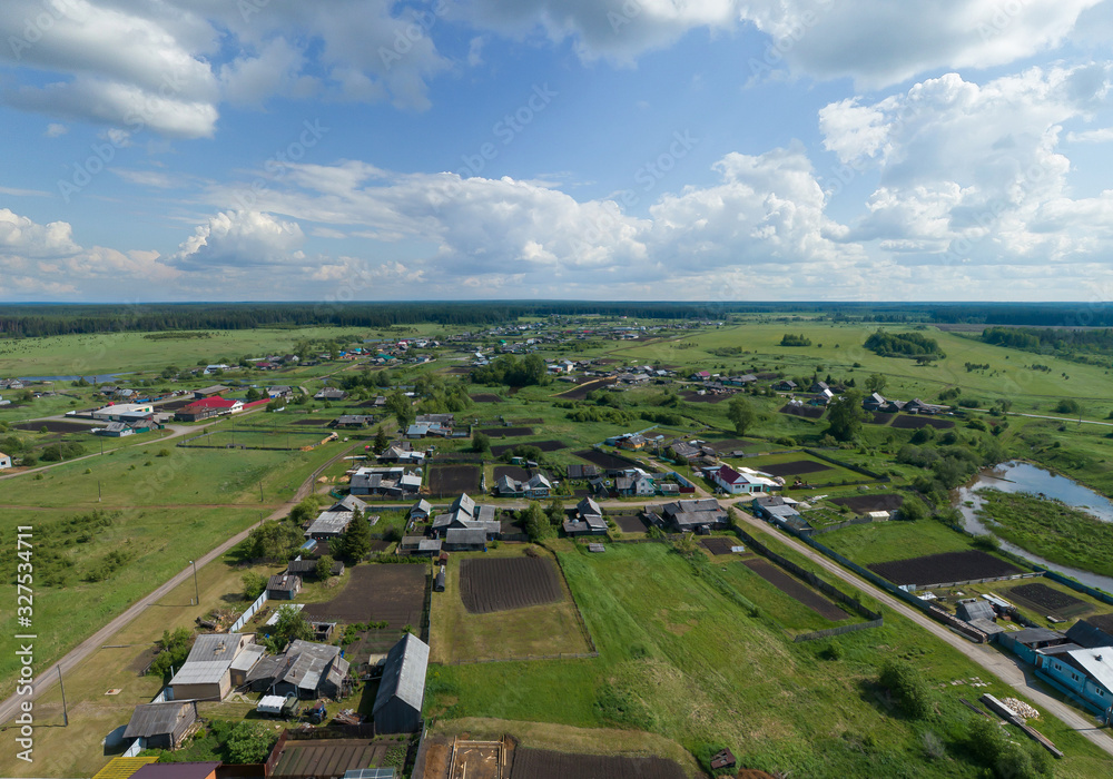 Aerial view of Lipovskoe village. A lot of grass and trees. Russia, Sverdlovsk region