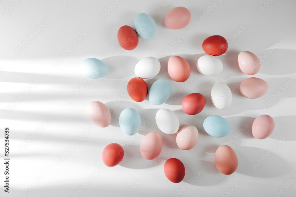 Natural Colored Eggs with sunlights. Compositions in pastel colors. Easter consept. Flat lay, top view Natural Colored Eggs with sunlights. Compositions in pastel colors. Easter consept. Flat lay, top view