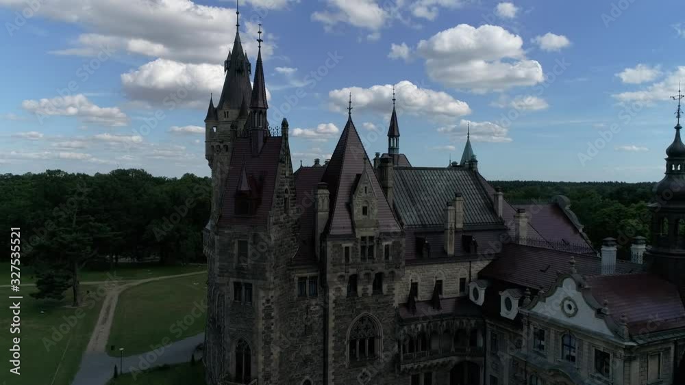 Aerial view of The Moszna Castle in Poland, the one of the most magnificent castles in the world. Famous places in Europe to see. World heritage Aerial view of The Moszna Castle in Poland, the one of the most magnificent castles in the world. Famous places in Europe to see. World heritage