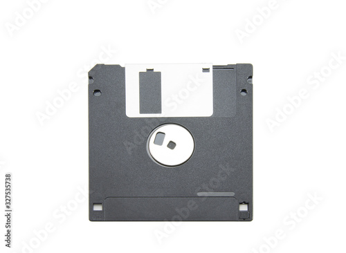 Old black floppy disk for FDD drive. Digital vintage drive. 1.44 megabyte retro data warehouse. Diskette on a white isolated background. Good quality.