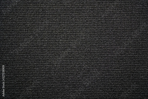 Black background carpet with small horizontal stripes