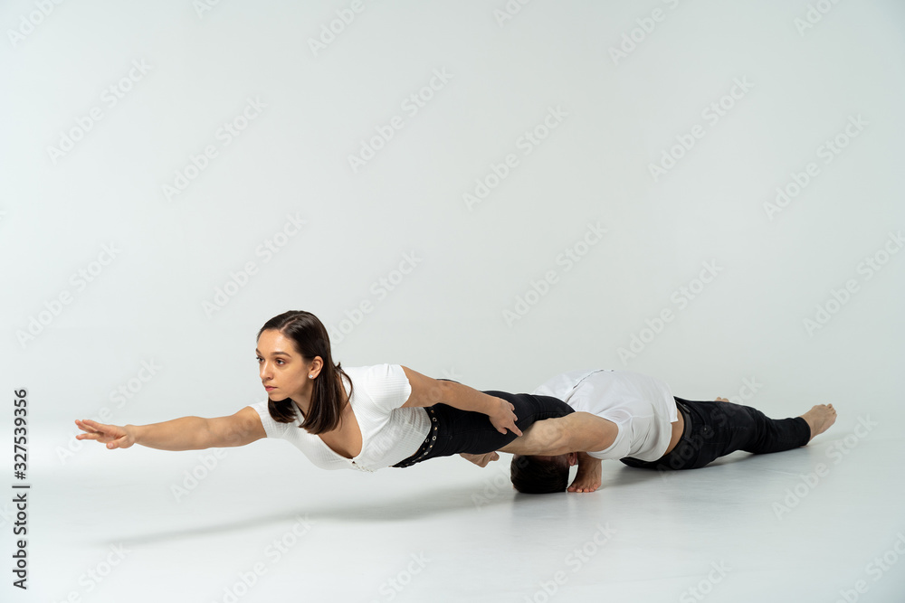 Fototapeta premium Duo Of Acrobats Showing Tricks, Isolated On White