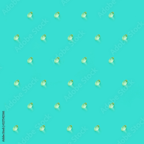 Vitamin d pattern on turquoise background.