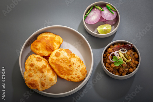 choley bhature is a dish originated initially in the northern part of the Indian subcontinent.  It is a combination of chana masala and bhatura, a fried bread made from maida.