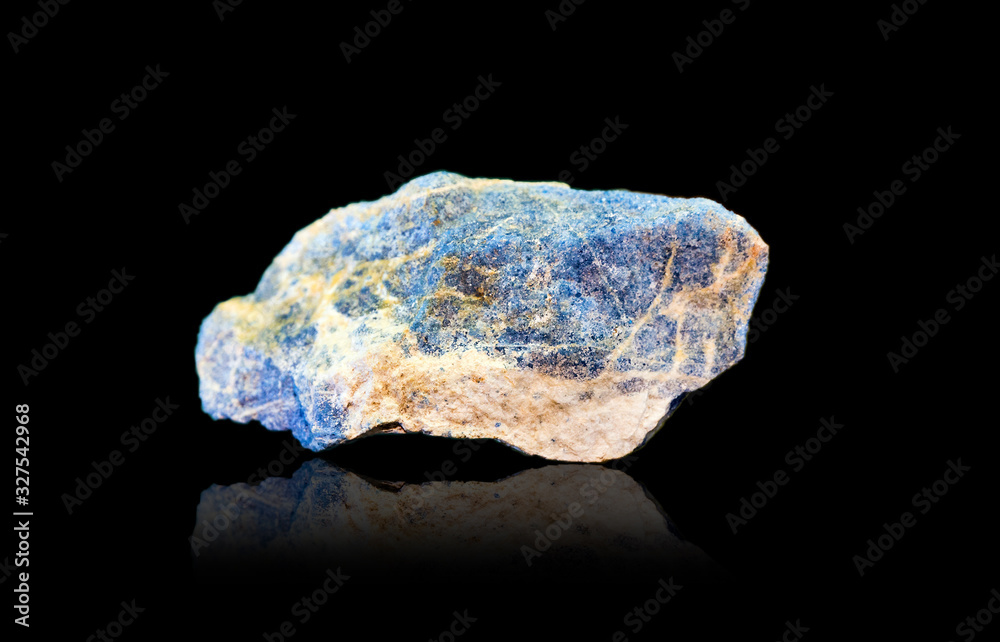 Blue lapis lazuli with pyrite on a black background Blue lapis lazuli with pyrite on a black background