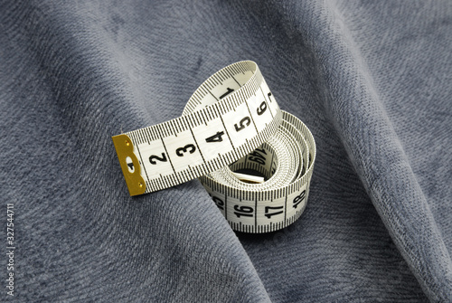 measure tape on fabric background