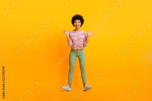 Full length photo of crazy funny afro american girl fun autumn vacation boyfriend get imagine dream wish gift scream wow omg unbelievable wear good look clothing isolated vivid color background