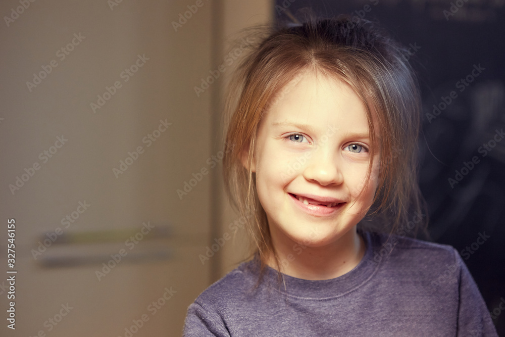 A school-age girl without a front tooths is laughing. Close-up. Change of teeth. A school-age girl without a front tooths is laughing. Close-up. Change of teeth.