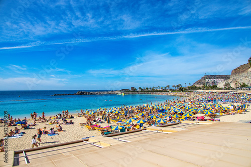 sunny landscape with the picturesque colorful Amadores beach on the Spanish Canary Island of Gran Canaria © Joanna Redesiuk