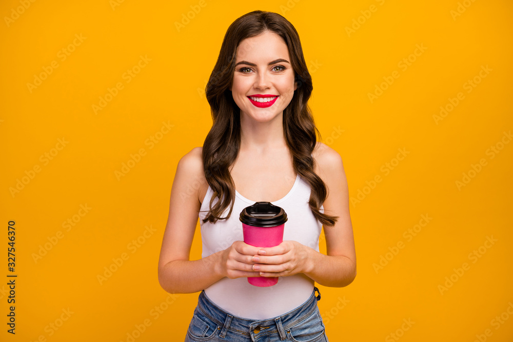Photo of funny pretty lady hold pink paper takeout coffee cup hot beverage spend free time leisure rejoicing wear white tank-top jeans isolated bright yellow color background Photo of funny pretty lady hold pink paper takeout coffee cup hot beverage spend free time leisure rejoicing wear white tank-top jeans isolated bright yellow color background